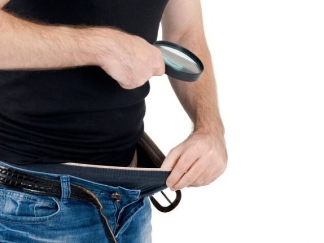 a man looks in his pants and wants to enlarge his penis